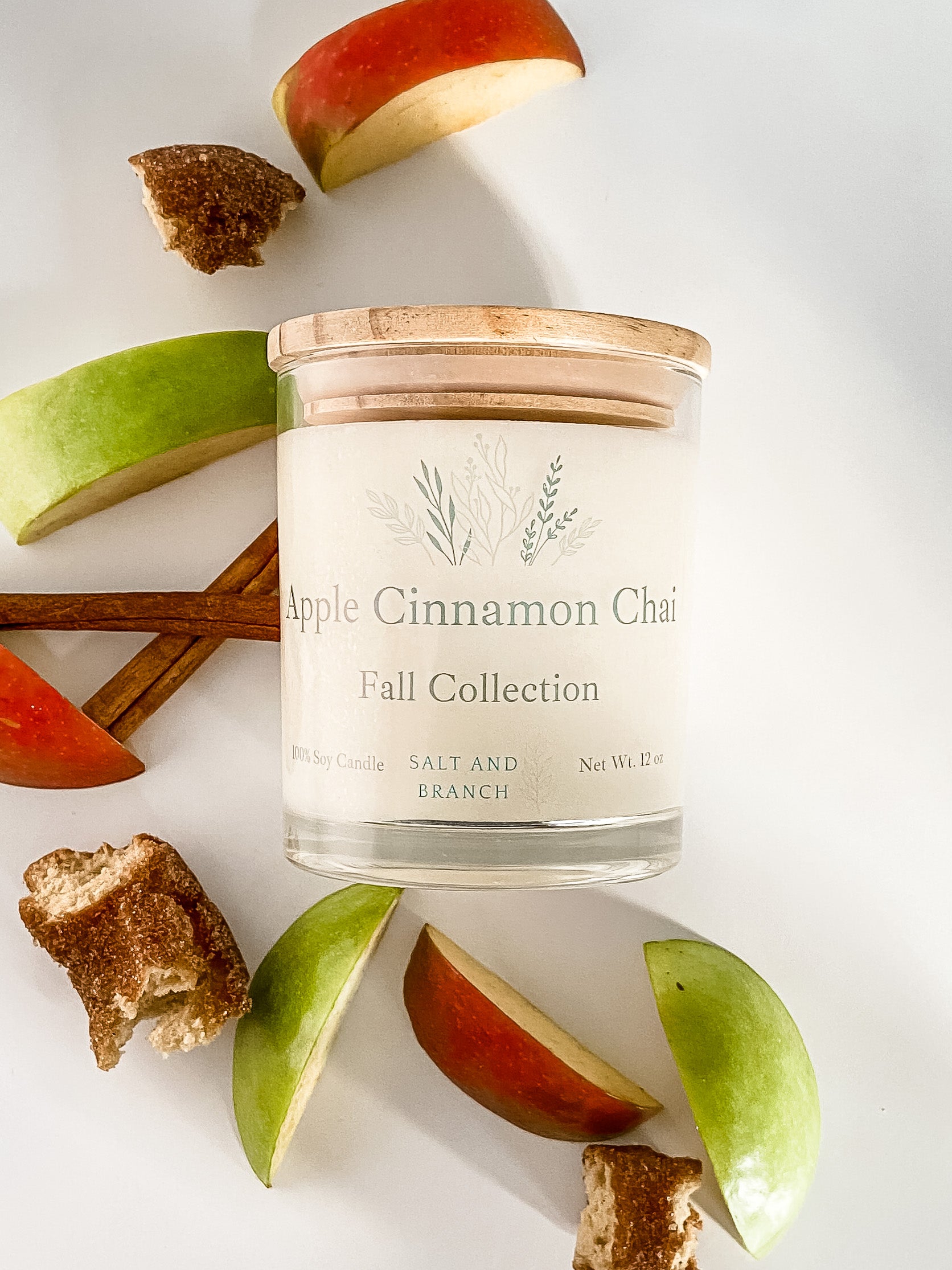 Apple Cinnamon Chai Soy Candle with cinnamon and apple slices